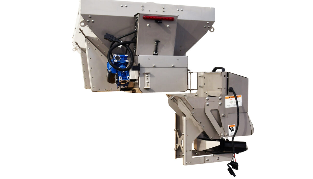 Industrial machine with a large metal hopper, blue motor, automated wiring, and control box, designed for material processing or dispensing, isolated on a white background.